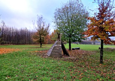 teepee tent is equipped on the inside with furniture for groups of children in kindergarten. outdoor lessons combined with games in the meadow and drawing will not hurt clipart