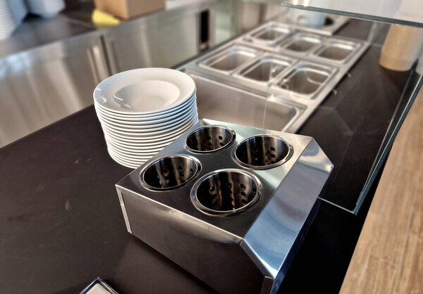 serving food in a heated kitchen counter with a glass partition of the counter. ice cream delivery in refrigeration