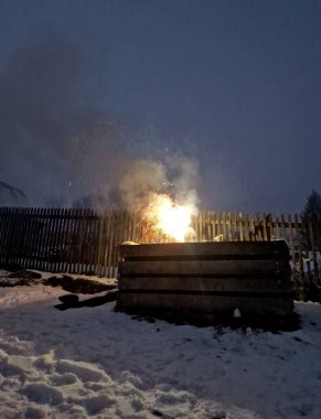 fire show on the wooden fence. fire fountain on the railing. wild actions mark military targets for artillery to destroy. dangerous soldier games, new year clipart