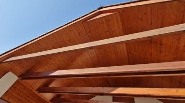 terrace with wooden pergola and plexiglass roof. vines are straining, crawling under the beams. garden or park. sitting with dry wall wine region. restaurant countryside france, truss