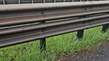 arresting system made of steel construction stops vehicles in a controlled manner in event frontal impact red and white end barriers can also redirect an uncontrollable car, shock absorber bent