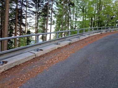 The narrow mountain roads are only plowed. snow barriers line the edge paths. sheet metal downpipes will protect against slipping into a forest ravine. a challenging ride on an untreated salt road