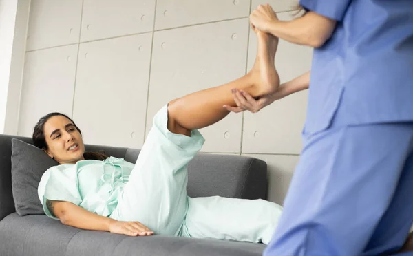 Female Caucasian Physiotherapist Rehabilitation Hispanic Patient Doctor Doing Stretching Patient — Stock Photo, Image