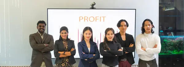 Group of diversity workers showing their confident, arm crossed posture. Successful business teamwork colleagues standing and smiling together.