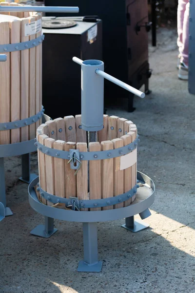 Manual grape press. Grape press at a wine fair in Moldova at November, selective focus, shallow depth of field