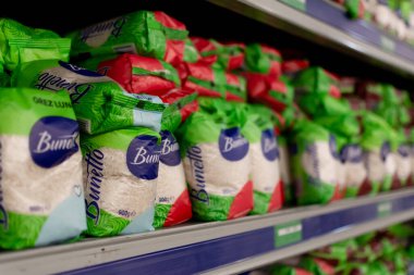 Chisinau, Moldova - October 14, 2022: Packs of long grain rice brand Bunetto on the shelves of a Metro Cash Carry hypermarket. Rise packings in a Store