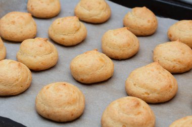 French Cheese Puffs. Freshly baked French cheese mini buns, selective focus, shallow depth of field