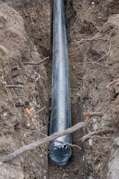 Plumbing industrial pipe laying. Industrial plastic polypropylene pipe. Sanitary, sewer drainage system for a multi-story building. Civil infrastructure pipe, water lines and storm sewers