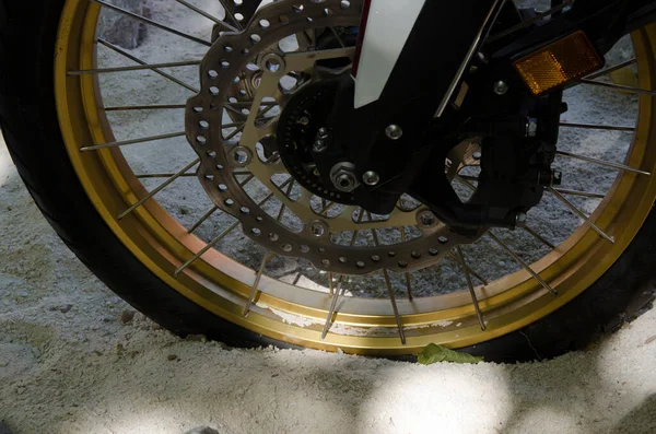 motorcycle wheel in the sand. tire and rubber of dirt bike on sandy terrain, selective focus