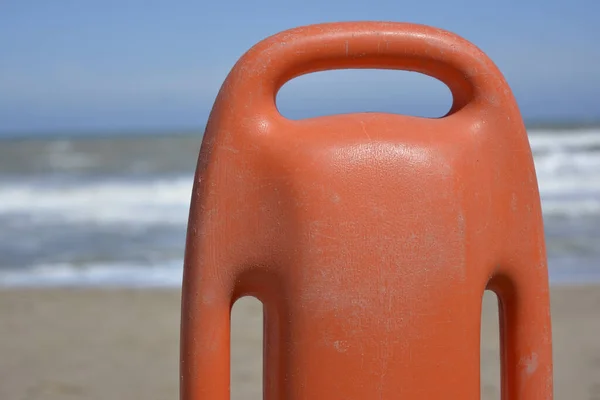 Orange Plastic Life Preserver Foreground Sea Background Lifeguard Tool Stock Picture