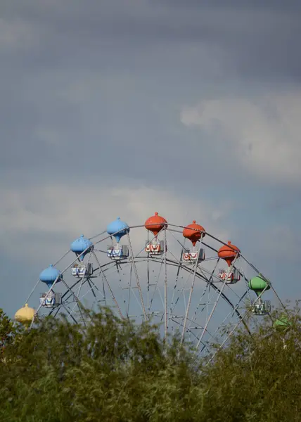 stock image around the world with colored seats in delta del tigre. amusement park game