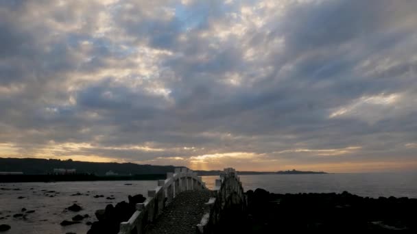 Dynamic Fast Moving Clouds Red Sunset Rocky Coast Bridge View — Wideo stockowe
