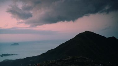 At dusk, dynamic clouds. People feel romantic, comfortable, free and peaceful. The scenery of mountains and seas in Ruifang, New Taipei City. Taiwan