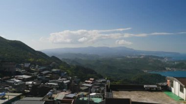 Dynamic white clouds in the blue sky. People feel comfortable, free and calm. The scenery of mountains and seas in Ruifang, New Taipei City. Taiwan