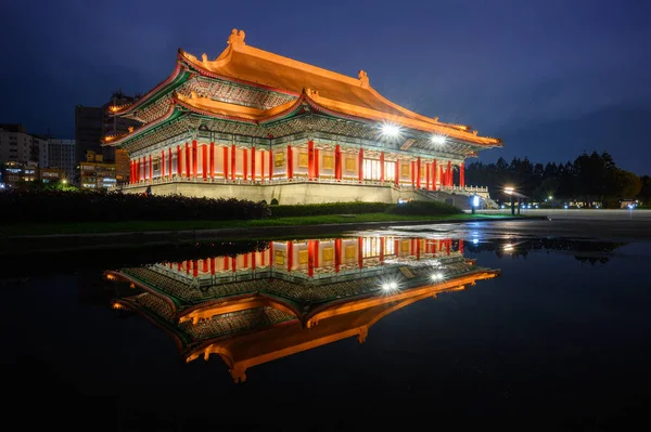 stock image There are beautiful reflections on the water in Liberty Square. The Chiang Kai-shek Memorial Hall and the National Concert Hall after the rain.