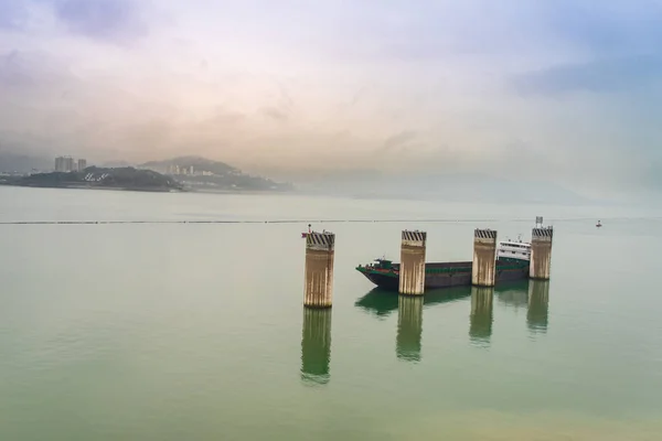 The mesmerizing view of the Three Gorges Dam shrouded in mist demonstrates the perfect combination of nature and human engineering.