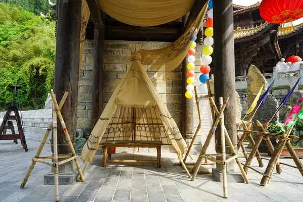 The ancient Chiyou people slept in a tent when they were nomadic. Chiyou Jiuli City integrates Miao culture and architecture. Chongqing, China.
