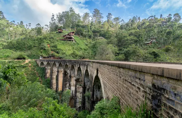 A captivating view of the Nine Arch Bridge, in Demodara, Sri Lanka. The high arch bridge, made of cement and bricks, dates back to the British colonial period.