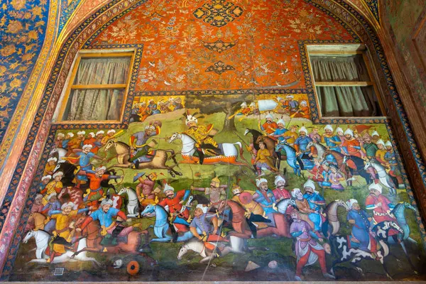 stock image Chehel Sotoun Palace, Iran - March 5, 2024: Detailed mural depicting themes of war and love. The walls of the palace are decorated with large and exquisite paintings.