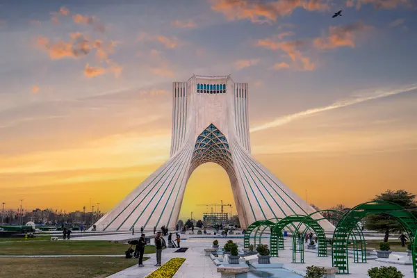 stock image Azadi Towers, Iran - March 7, 2024: At sunset, locals enjoy a leisurely evening at this iconic landmark in Tehran, the capital of Iran.