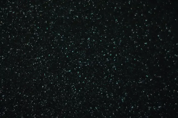 Soyut ışıltı arkaplanı. Siyah arka planda noel ışıkları