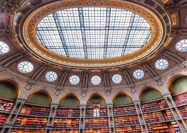 PARIS, FRANCE, OCTOBER 20, 2022 : Oval reading room in National Library, Richelieu site, Paris, france, built by architects Jean-Louis Pascal. and Alfred Recoura, from year 1897 to year 1932