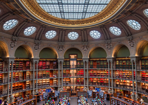 PARIS, FRANCE, OCTOBER 20, 2022 : Oval reading room in National Library, Richelieu site, Paris, france, built by architects Jean-Louis Pascal. and Alfred Recoura, from year 1897 to year 1932