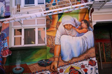 SAN FRANCISCO, CALIFORNIASEPTEMBER 17, 2014  Mexican murals painted walls of Casa de las mujeres, near Balmy Alley, september 17, 2014,  in  San Francisco, California, USA clipart