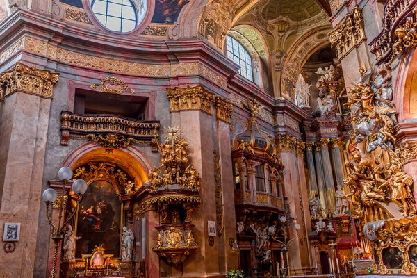 VIENNA, AUSTRIA, MAY 25, 2023 : interiors, frescoes and architectural details of Peterskirche church