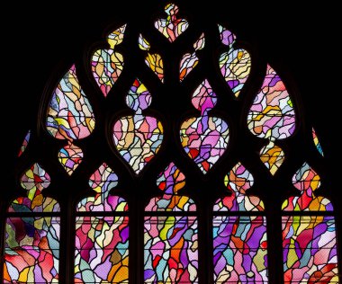 ABBEVILLE, SOMME, FRANCE, JUNE 20, 2023 :  details of stained glasses windows in Saint Sepulcre church, by Alfred Manessier workshop, year 1989  to 1993 clipart
