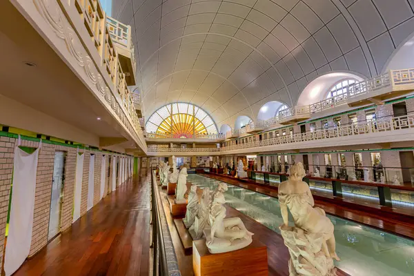 stock image ROUBAIX, FRANCE, JUNE 14,  2024 : interiors Art Deco decors and sculptures of the olympic swimming pool La Piscine, built year 1927 by the Lille architect, Albert Baert 