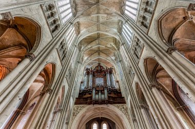 SAINT QUENTIN,  PICARDY, FRANCE, JUNE 12, 2024 : interiors and architectural details of gothic Cathedral basilica clipart