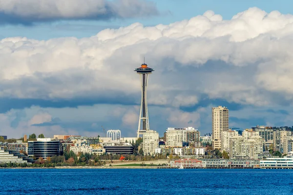 stock image Architecture of the Seattle skyline with Elliott Bay in front and clouds above.