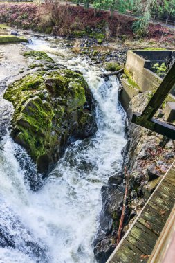 Rushing whitewater through rocks on the Deschutes River in Tumwater, Washingotn.