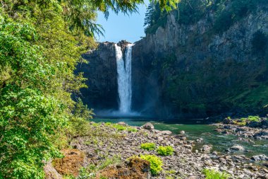 A view of Snoqualmie Falls in Washington State  from downriver. It is summertime. clipart