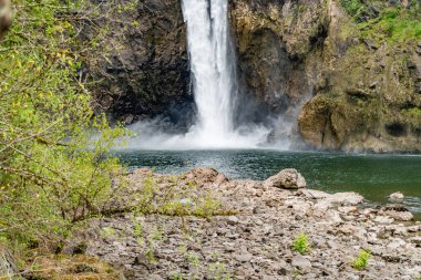 A view from down river of Snoqualmie Falls in Washington State. clipart