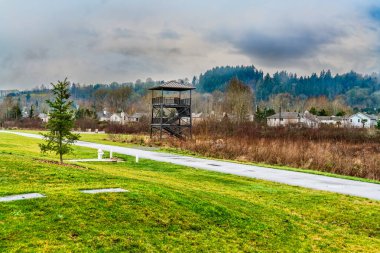 A view of a tower at a park along Green River in Kent, Washington. clipart