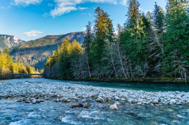 A view of a bridge spanning the Skagit River along Highway 20 in Washington State. clipart