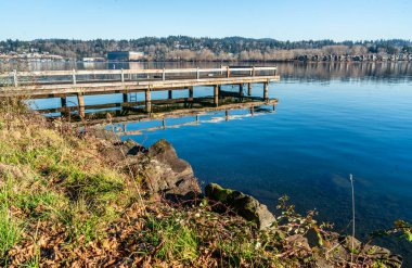 A pier along the shore of Mercer Island in Washington State. clipart