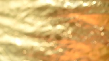 Bokeh 'in sarı ya da altın rengi. Odaklanmamış ışık. Bokeh tarzında yanıp sönen ışık arkaplanı. Parlak arkaplan