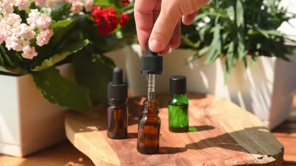 Bottles Essential Oils Natural Cosmetics Skin Care Woman Hand Holds — Vídeo de Stock