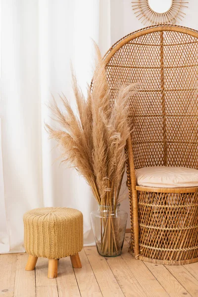 stock image wicker chair with wicker basket on white wall background