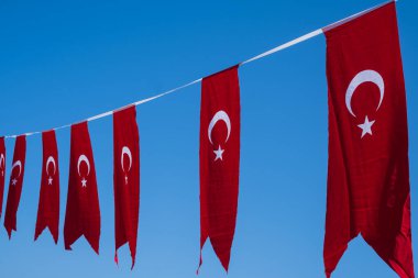 Turkey Flag. Decoration during republic day on blue sky clipart