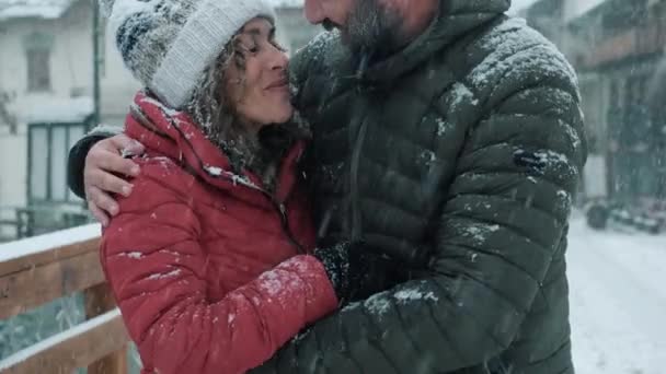 Couple Holding Hands Snowing Town Winter Holiday Vacation Mountain Man — Stock Video