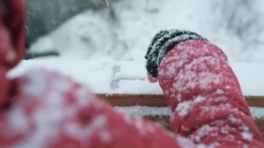 Back view pov of people writing on the snow with finger glove writing happy word message concept. Winter season holiday vacation and romance happiness lifestyle. Person in outdoor at snowfall