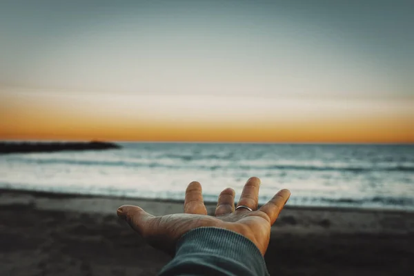 Pov Man Hand Opened Beautiful Sunset Lights Ocean Sky Background — Zdjęcie stockowe