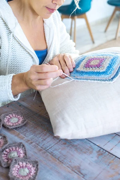 stock image Concept of art craft and hobby at home indoor leisure activity. One woman in embroidery job on a shabby chic pillow. New business and renewal. Creative art craft working person. Handmade decoration