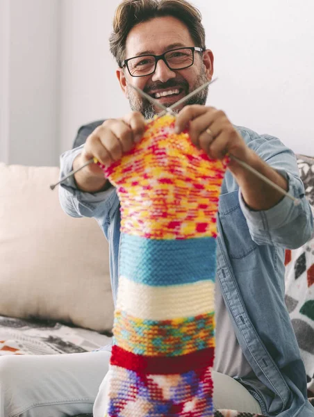 happy man with knitting scarf
