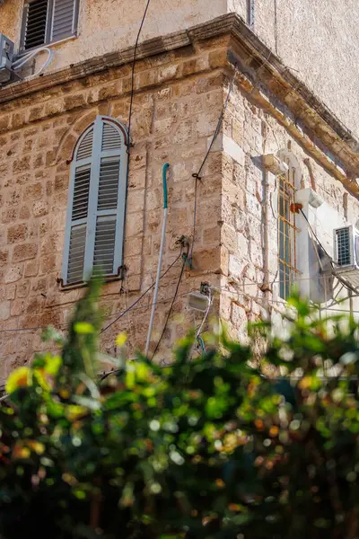 An Arabic house with palm trees in front in the city of Akko in northern Israel. Travel to Israel.