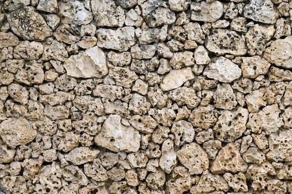 Stone wall porous pumice texture background